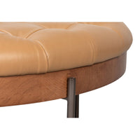Close-up of ottoman edge with wood finish.