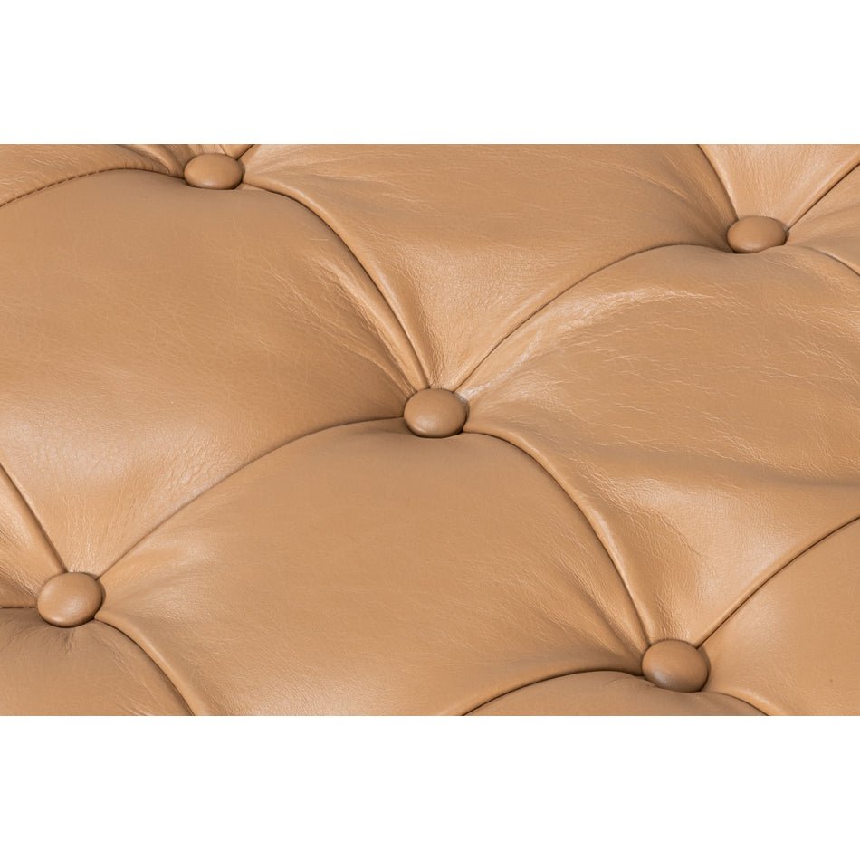 Close-up of caramel leather tufting details.
