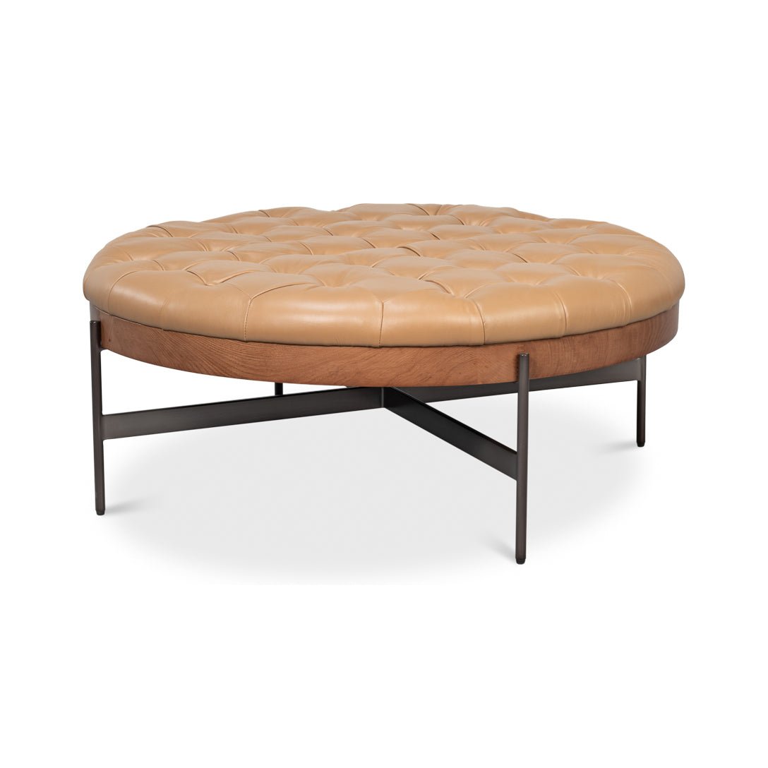 Ottoman side angle showcasing metal legs.