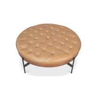 Top view of caramel leather ottoman tufting.