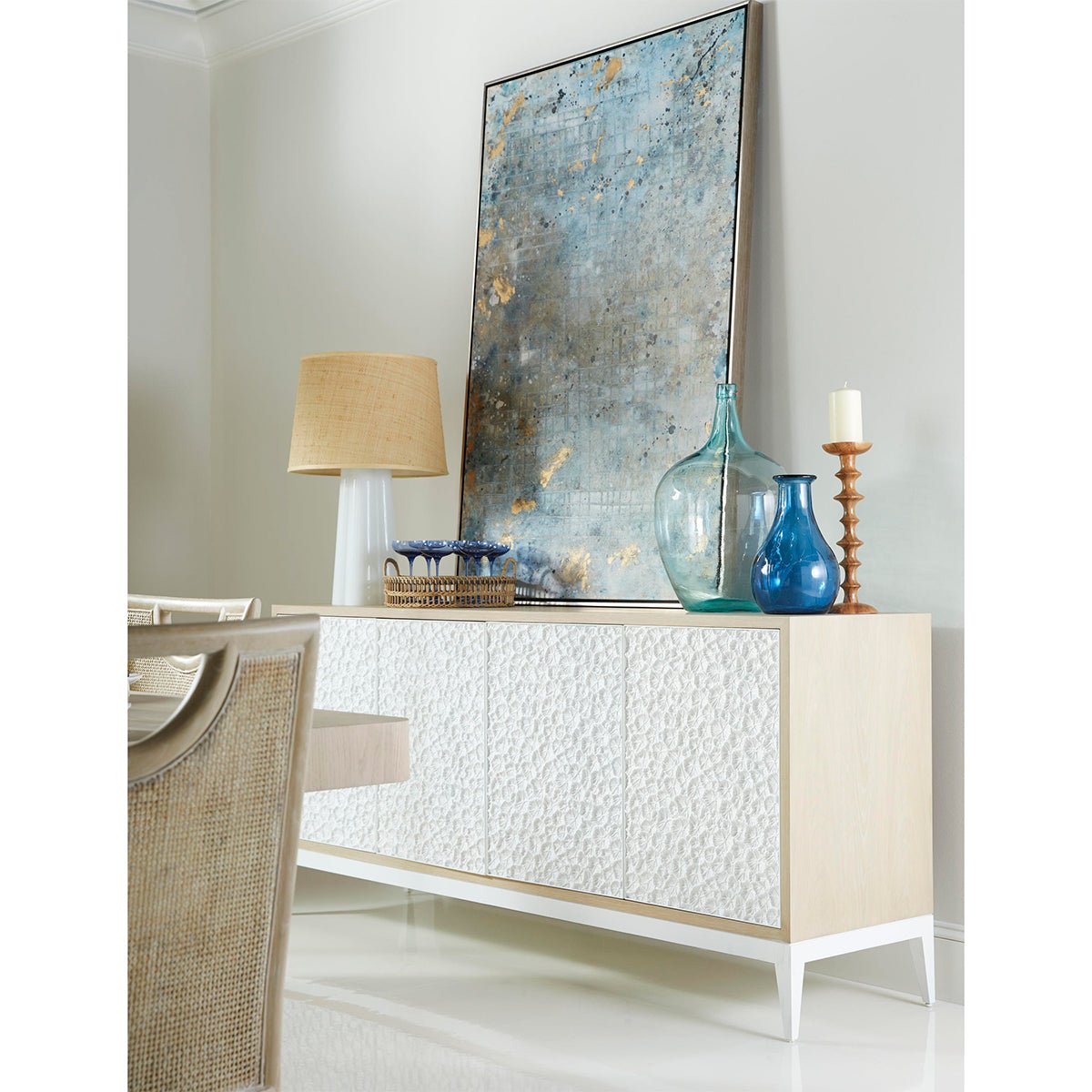 Styled modern sideboard in decorated room setting.