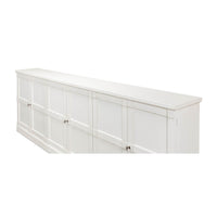 Angled side view of white painted sideboard.