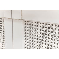 Close-up lattice detailing on white sideboard.