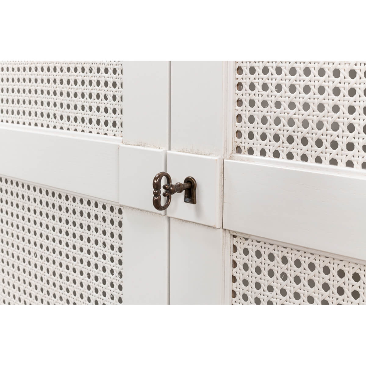 Latch detail on white sideboard, lattice doors.