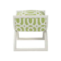 Side view of green modern curule stool, cushion visible.