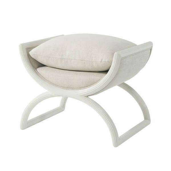 Light fabric modern curule stool, angled view with cushion.