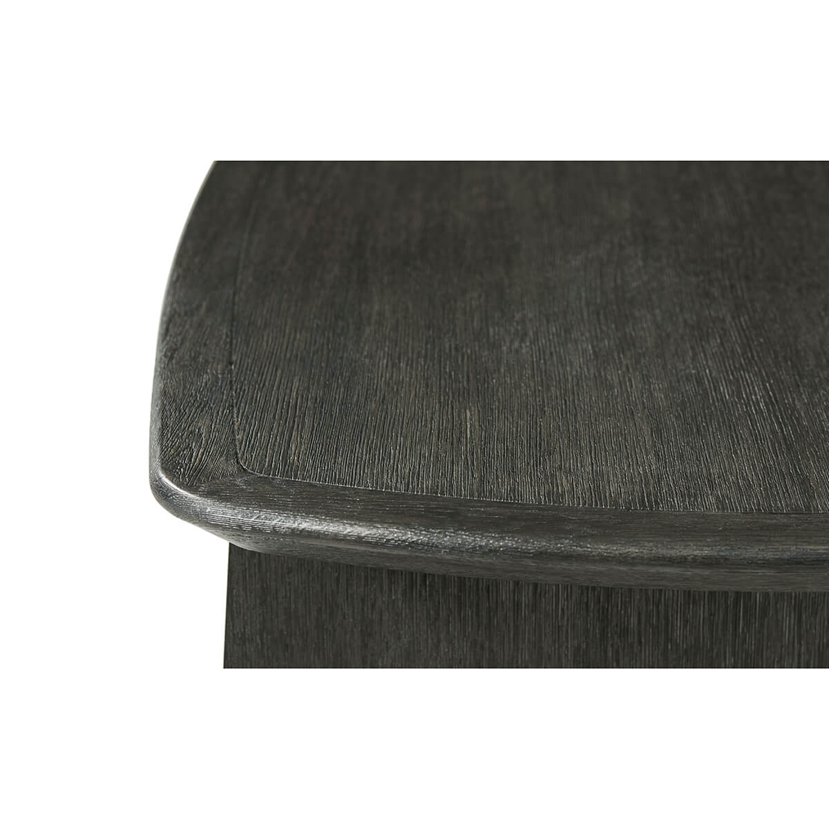 Close-up of dark oak desk corner detail.