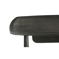 Close-up of modern desk edge and leg design.