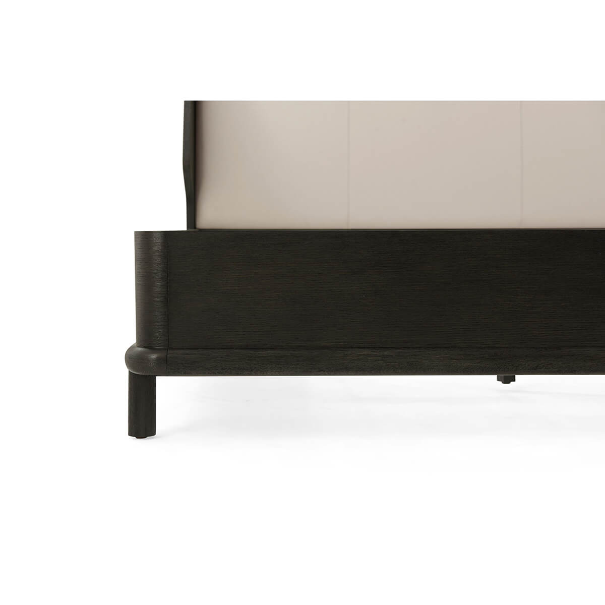 Close-up of corner details on dark oak bed frame.