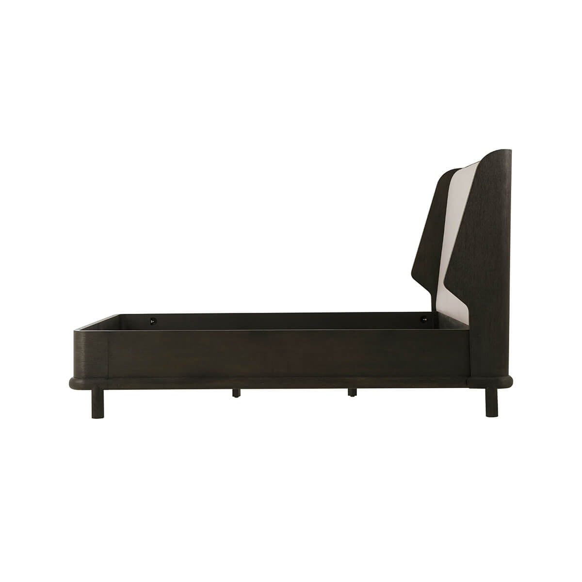 Side profile of dark oak luxury bed frame, no mattress.