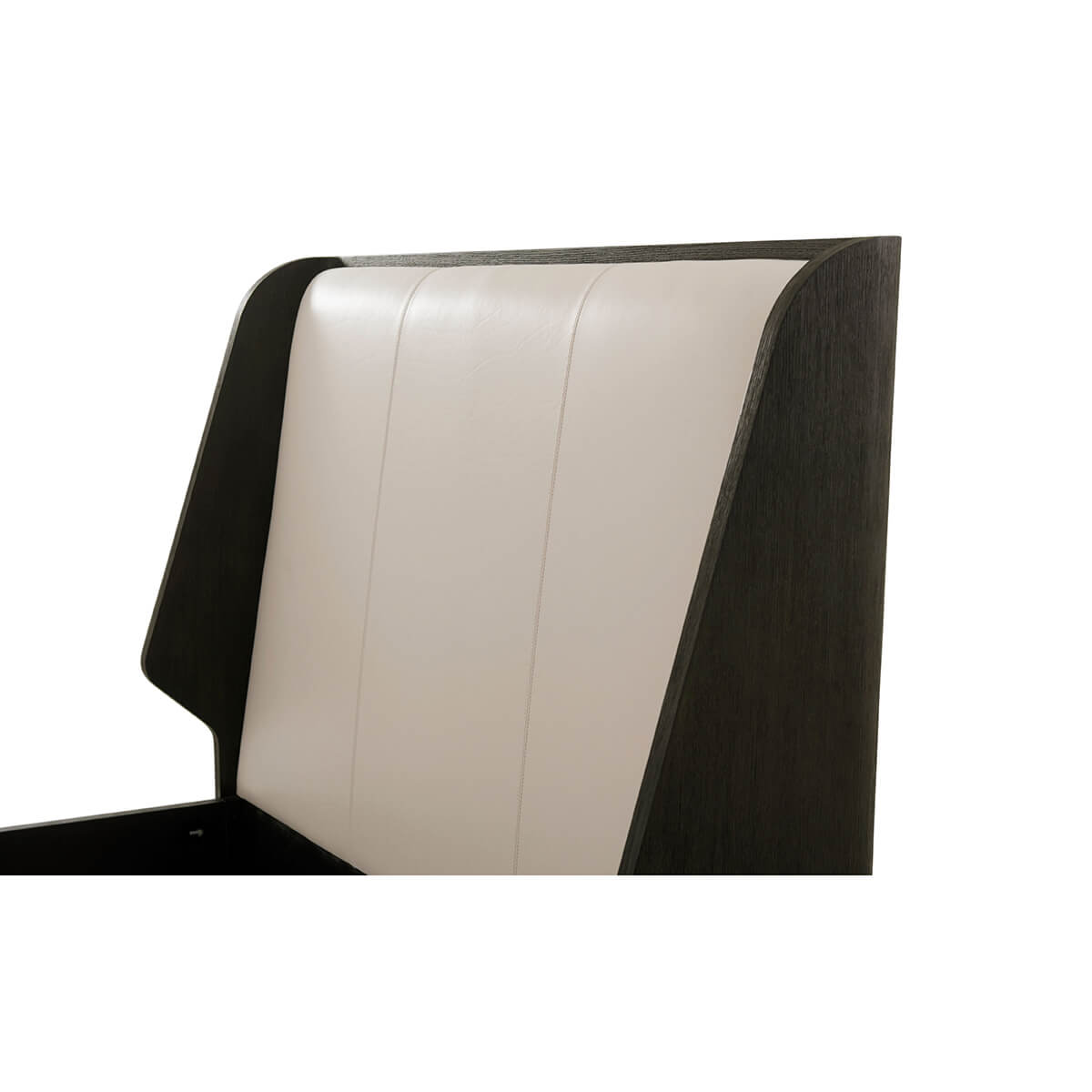 Close-up of luxury bed frame headboard, padded detail.