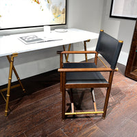 Modern director's desk chair next to a white desk