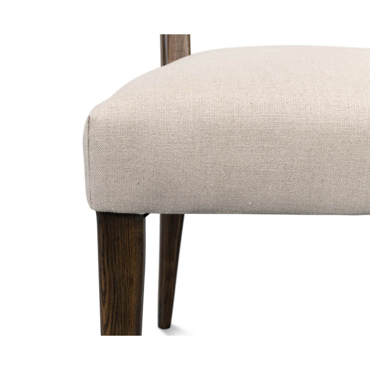 Close-up of chair upholstery and wood leg detail.