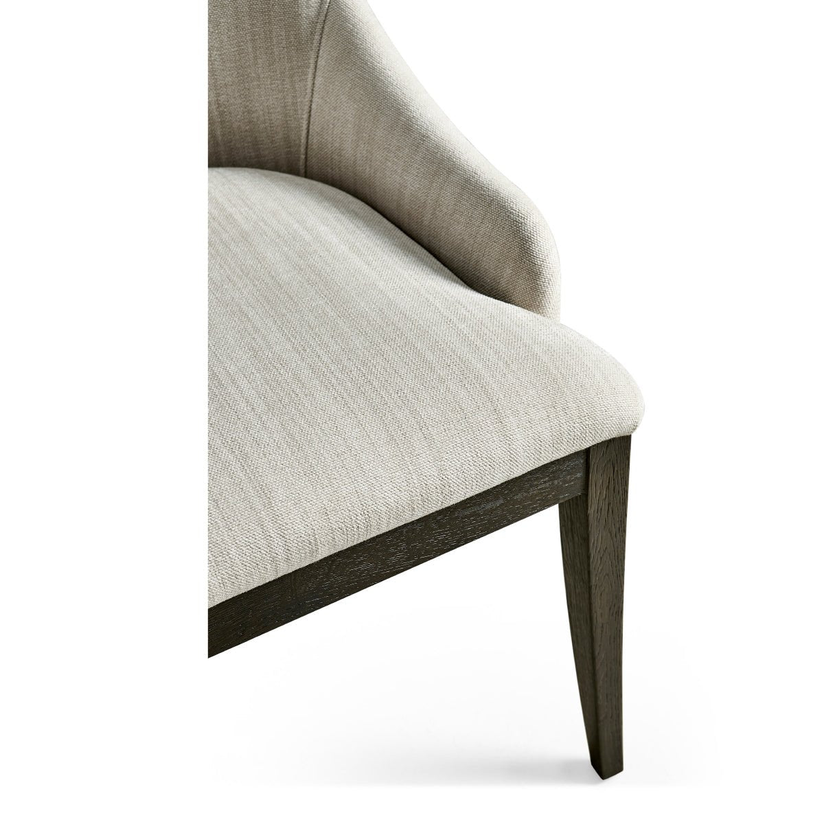 Modern English side chair, corner view, highlighting fabric and leg.