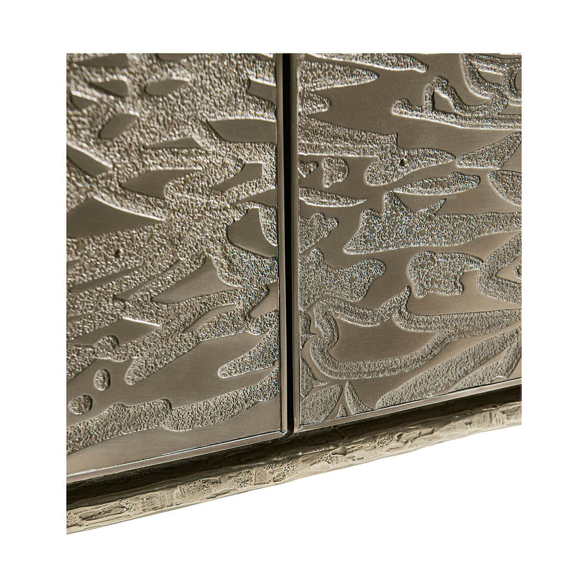 Detailed view of etched brass pattern on cabinet.