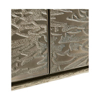 Detailed view of etched brass pattern on cabinet.