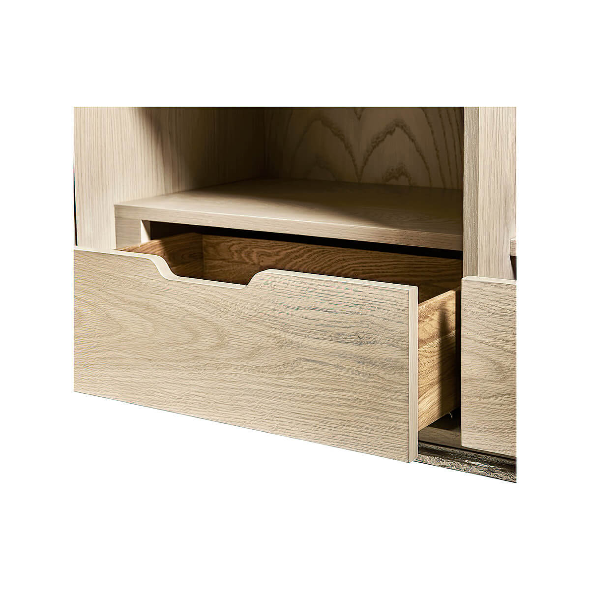 Close-up of drawer structure in brass cabinet interior.