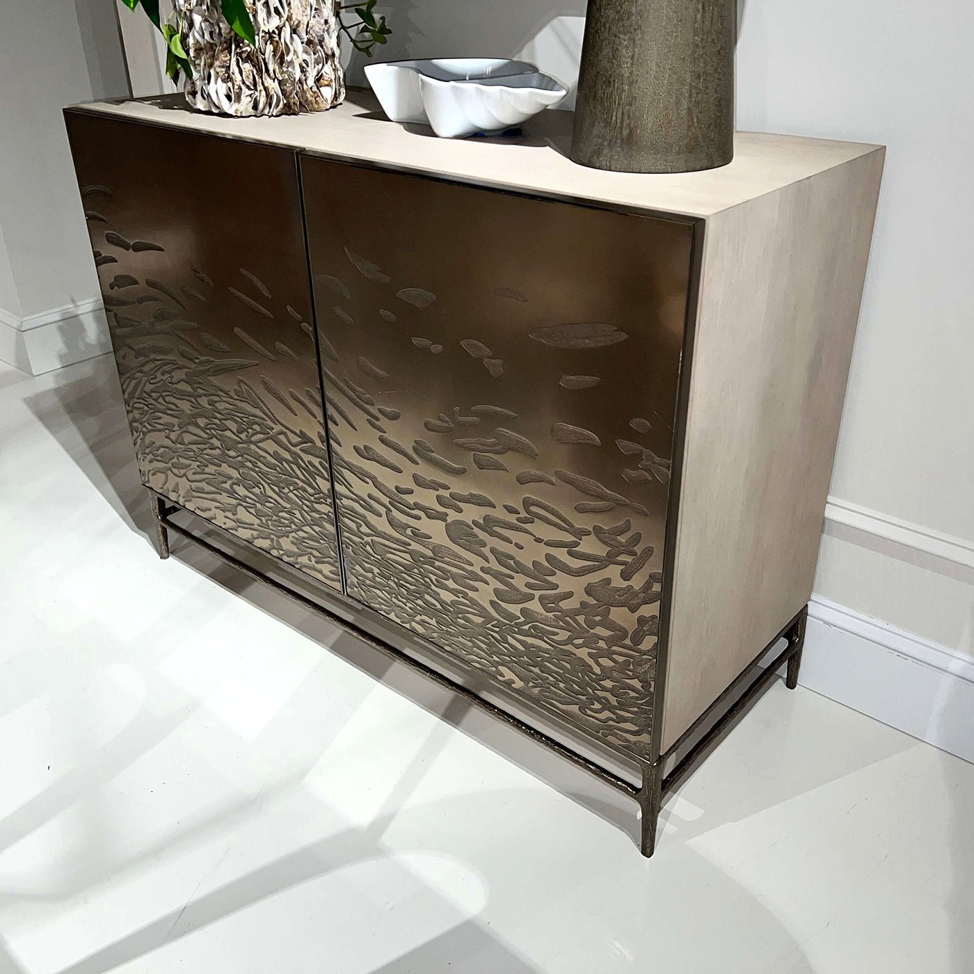 Brass cabinet displayed in modern home interior setting.