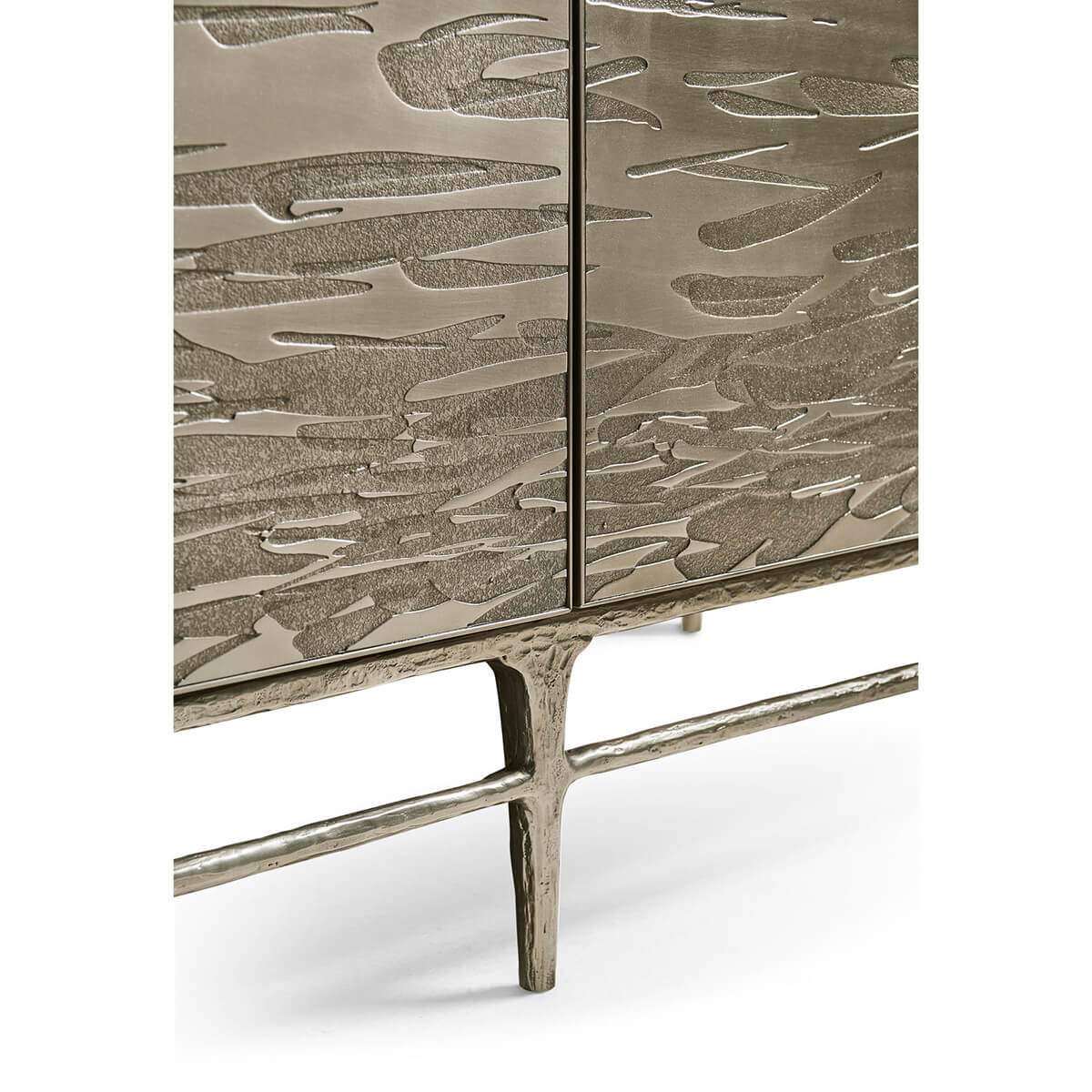 Close-up of textured brass pattern on cabinet doors