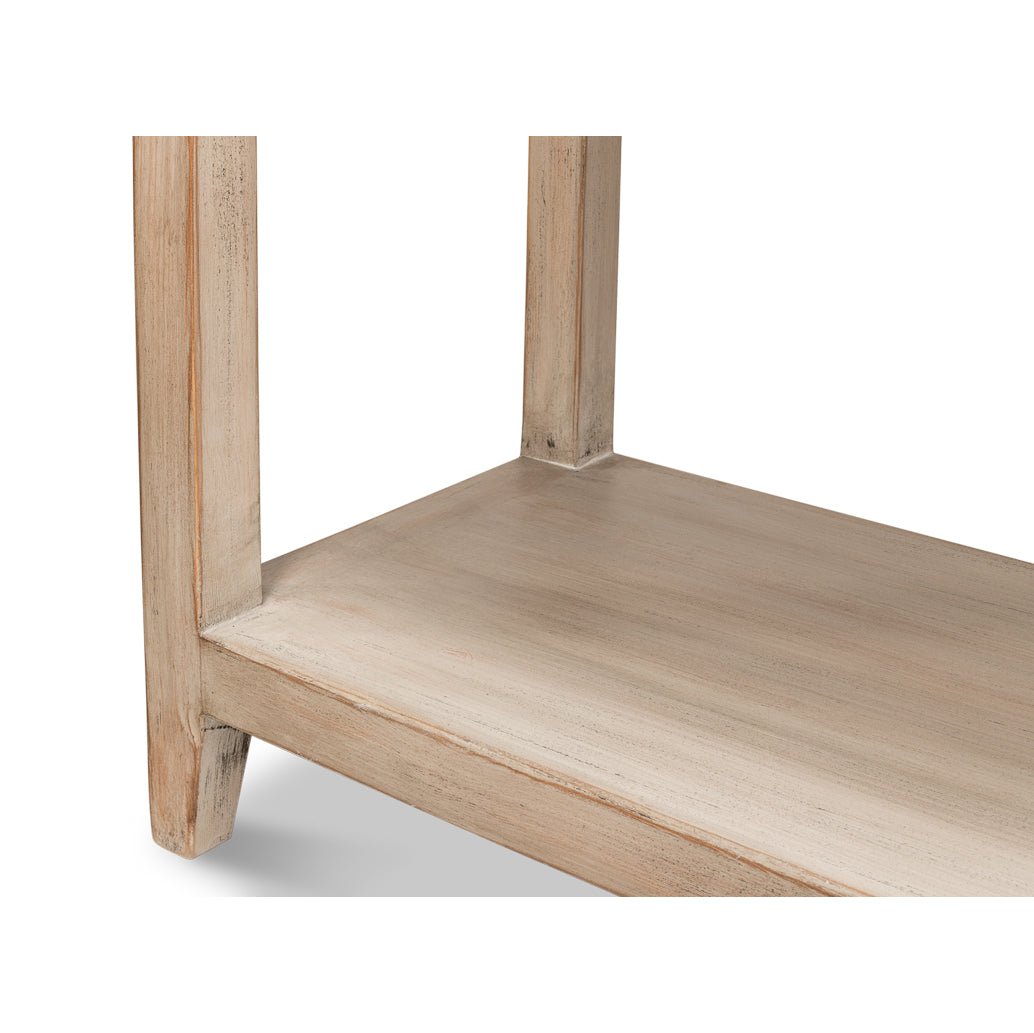 Lower shelf of modern farmhouse console table close-up.