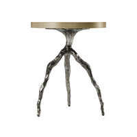 Front view of modern accent table with intricate legs.