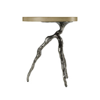 Profile view of modern accent table's leg design.