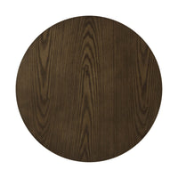 Close-up of circular wood tabletop with earthy finish.