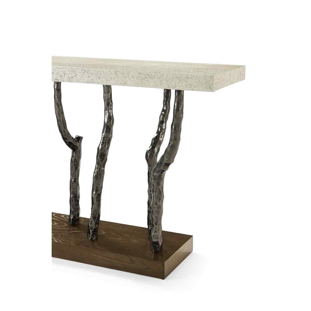 Angled view of console table with stone top and iron legs.
