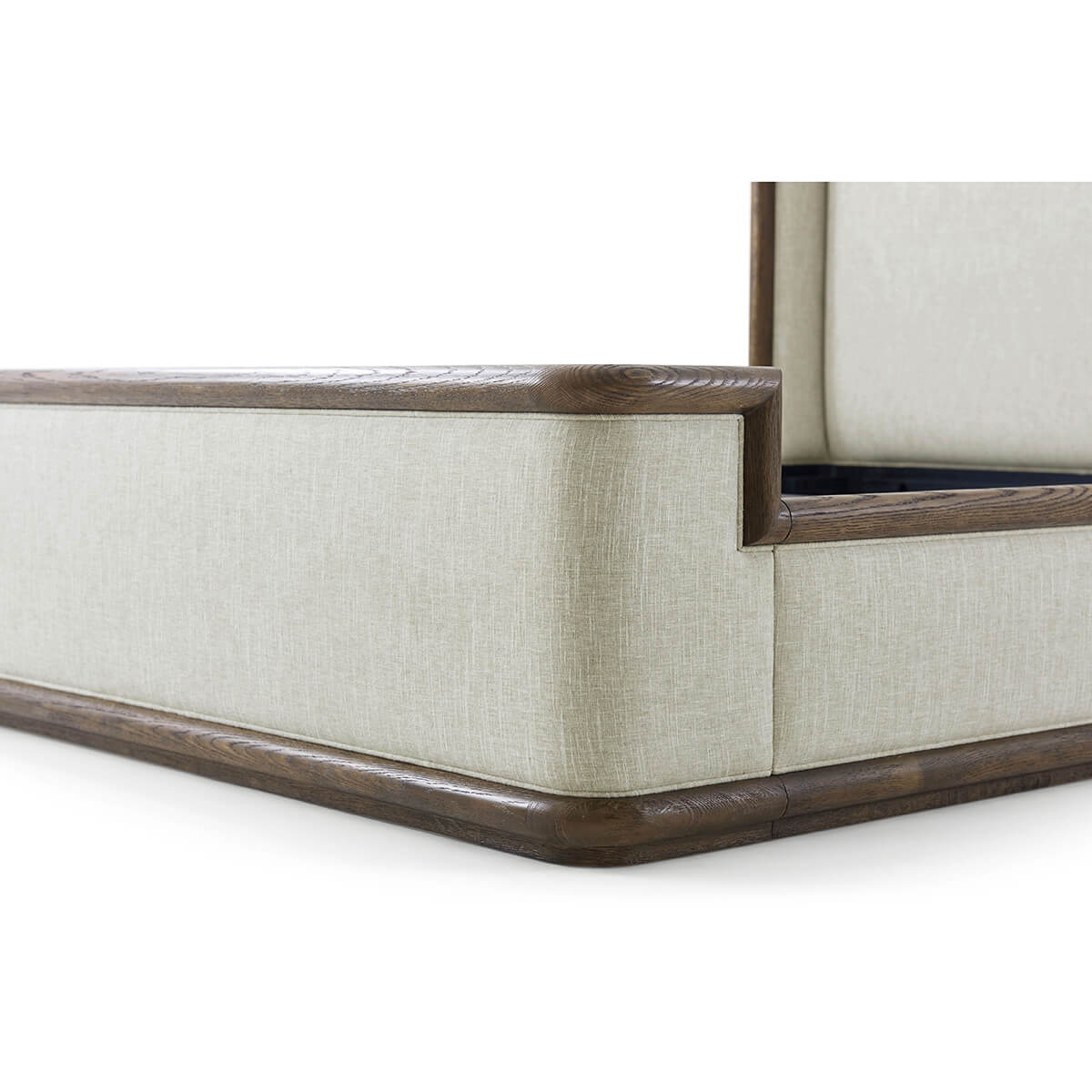 Corner detail of modern upholstered bed frame.