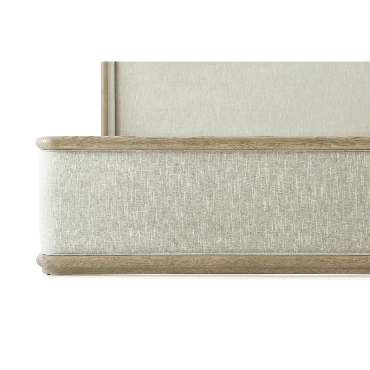 Close-up of footboard detail on the framed bed.