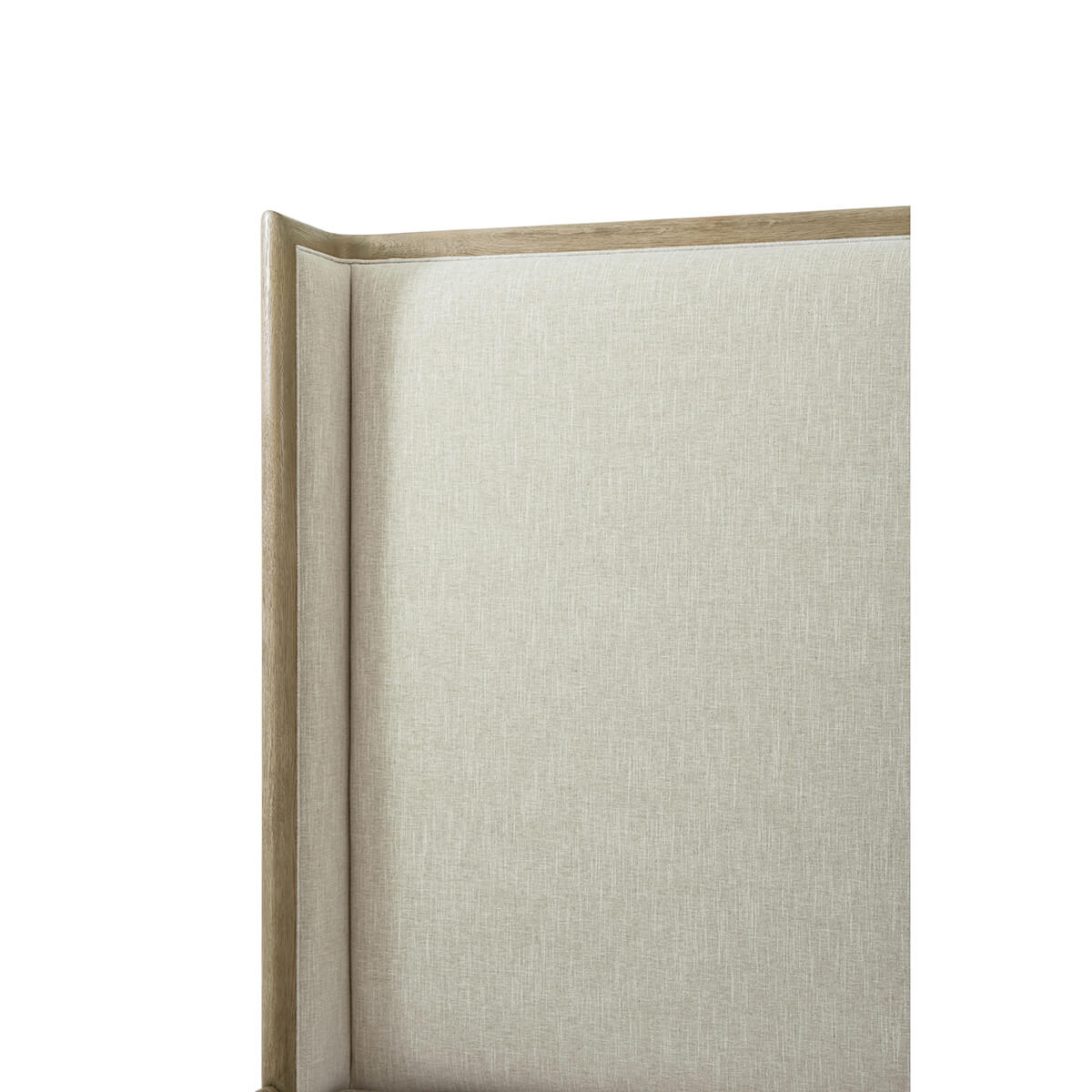 Close-up of the headboard on upholstered bed, light oak.