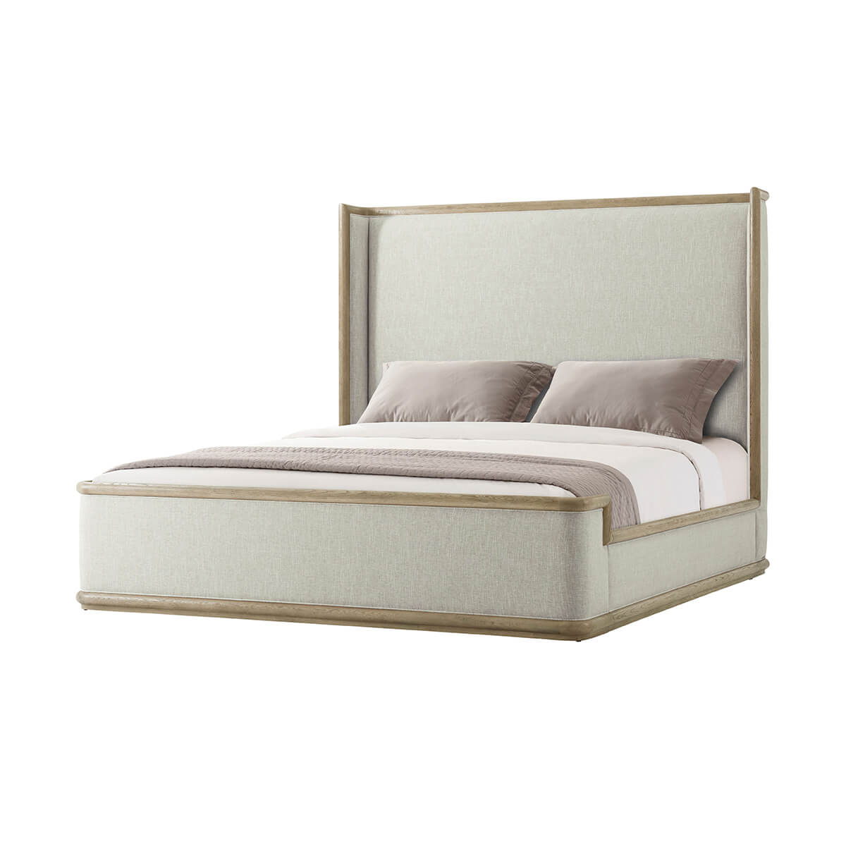 Angled view with pillows on a framed upholstered bed.