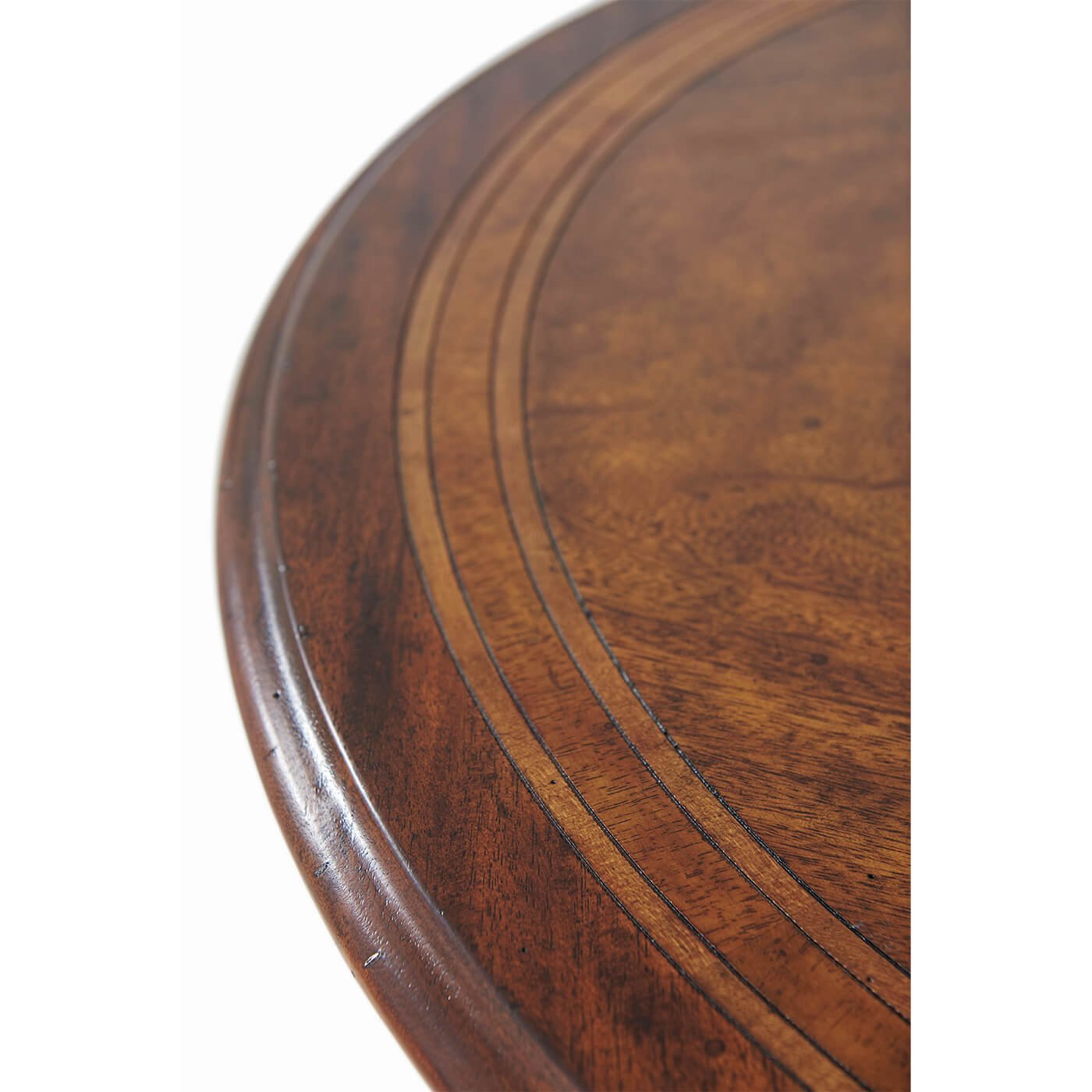 Close-up of round table's detailed wood grain pattern.