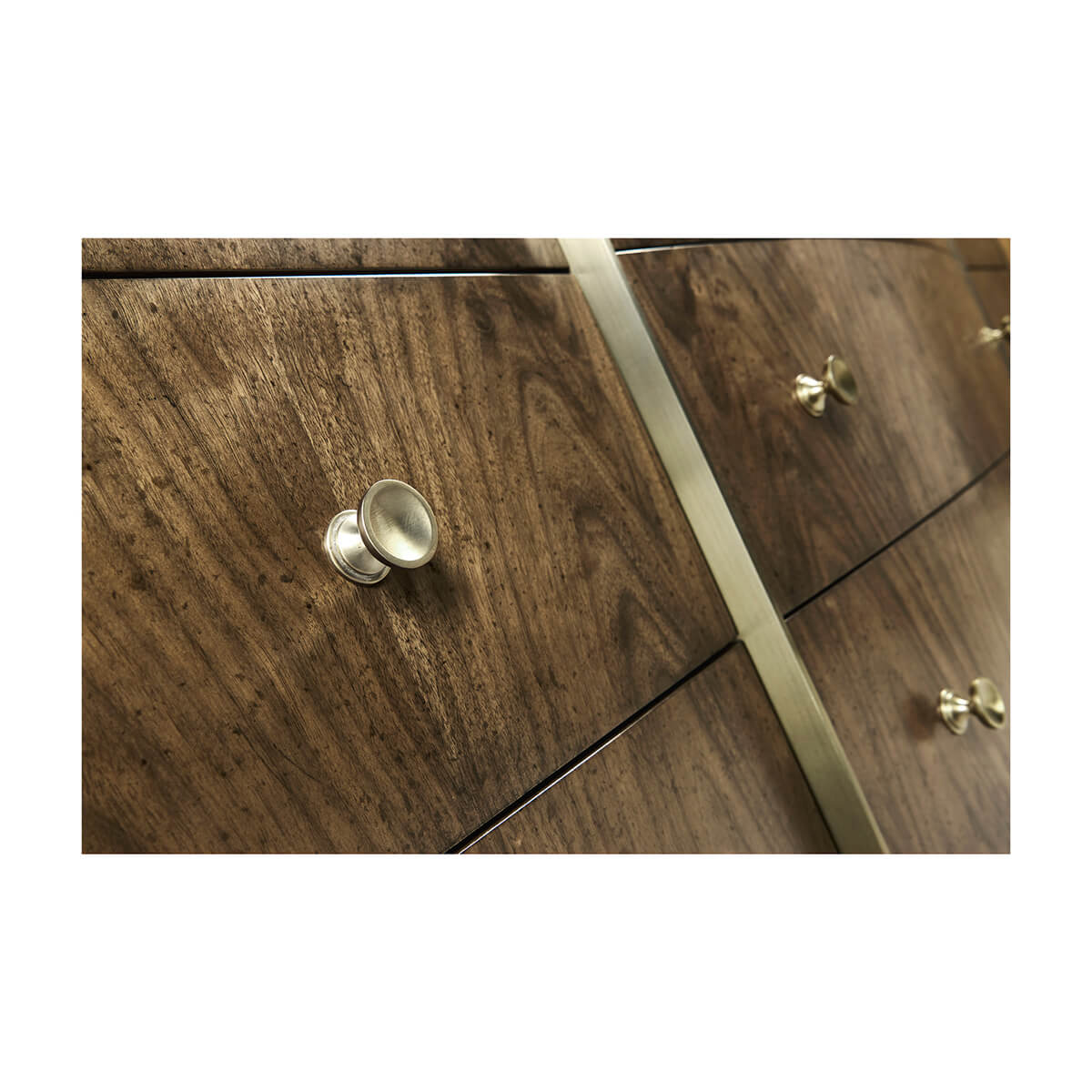 Close-up of drawer knobs on walnut dresser.