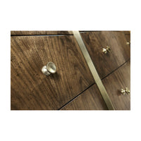 Close-up of drawer knobs on walnut dresser.