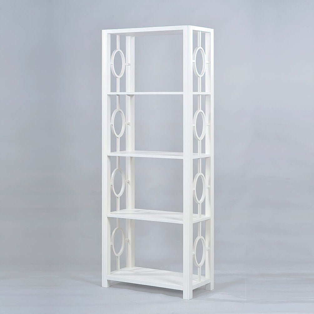 Tall white etagere with circular side decorations.