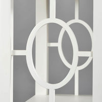 Detailed view of etagere circle pattern on sides.