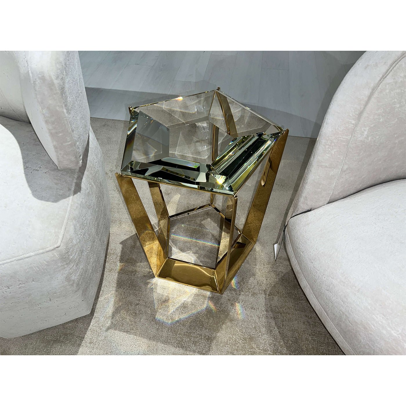 Hexagonal accent table placed in modern living room.