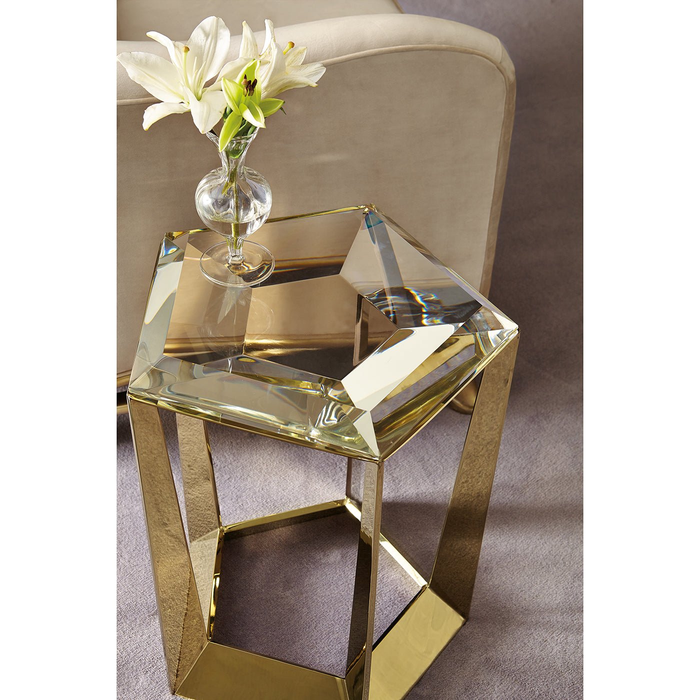 Top view of hexagonal glass accent table with flowers.