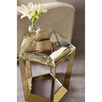 Top view of hexagonal glass accent table with flowers.
