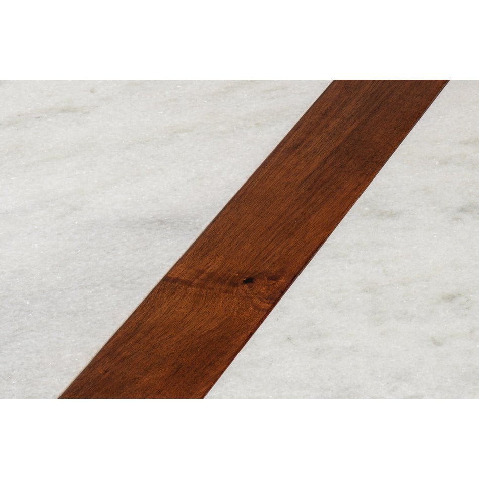 Close-up of marble surface with wood insert detail.