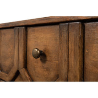 Close-up of sideboard knob and geometric detail.