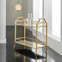 Gold bar cart in a modern interior setting.