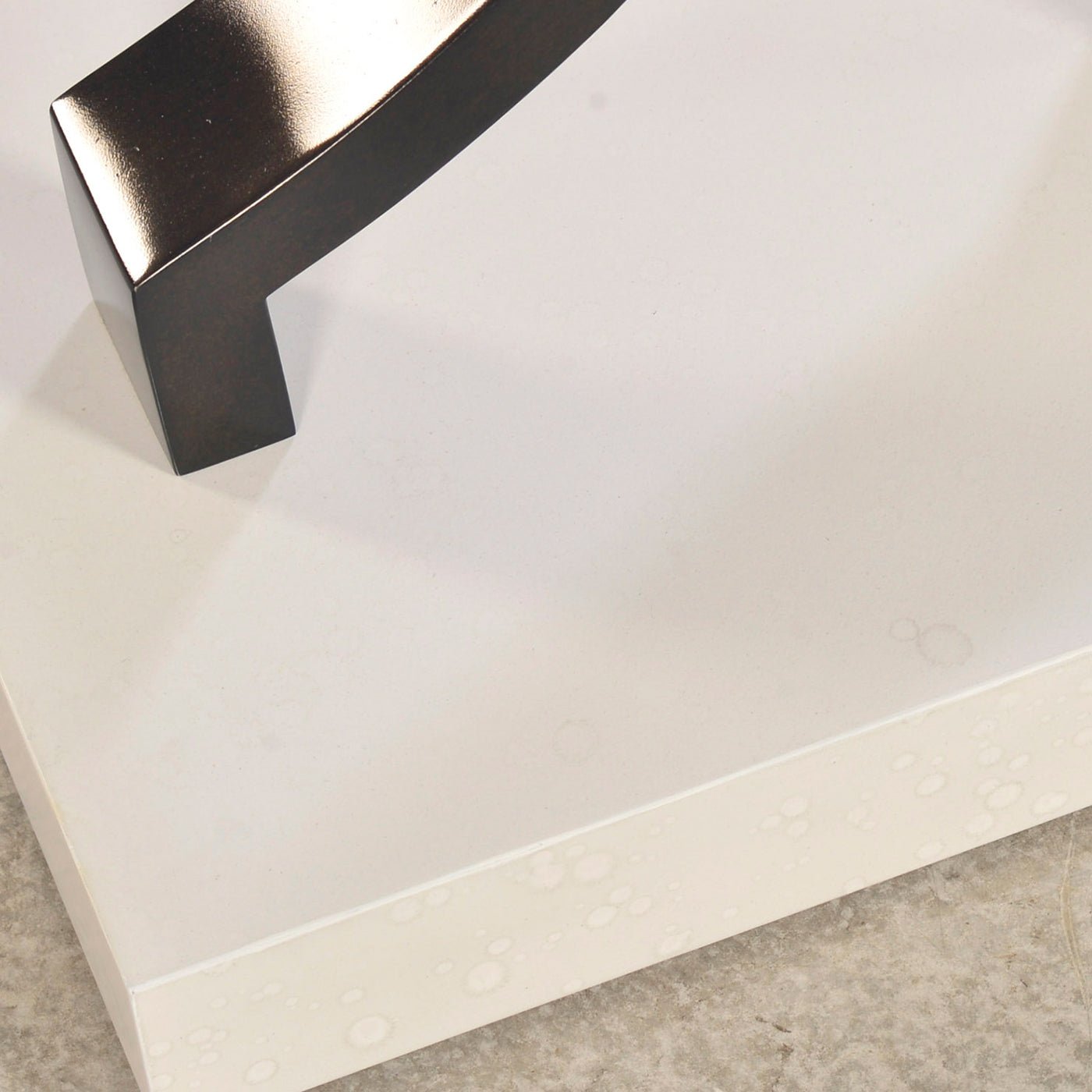 Bottom detail of console table with white base.