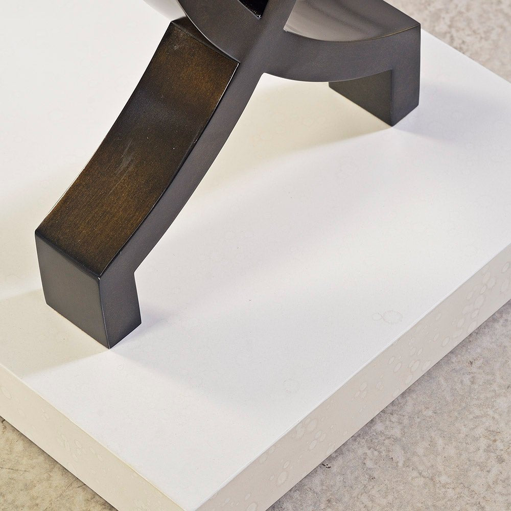 Console table base close-up on white platform.