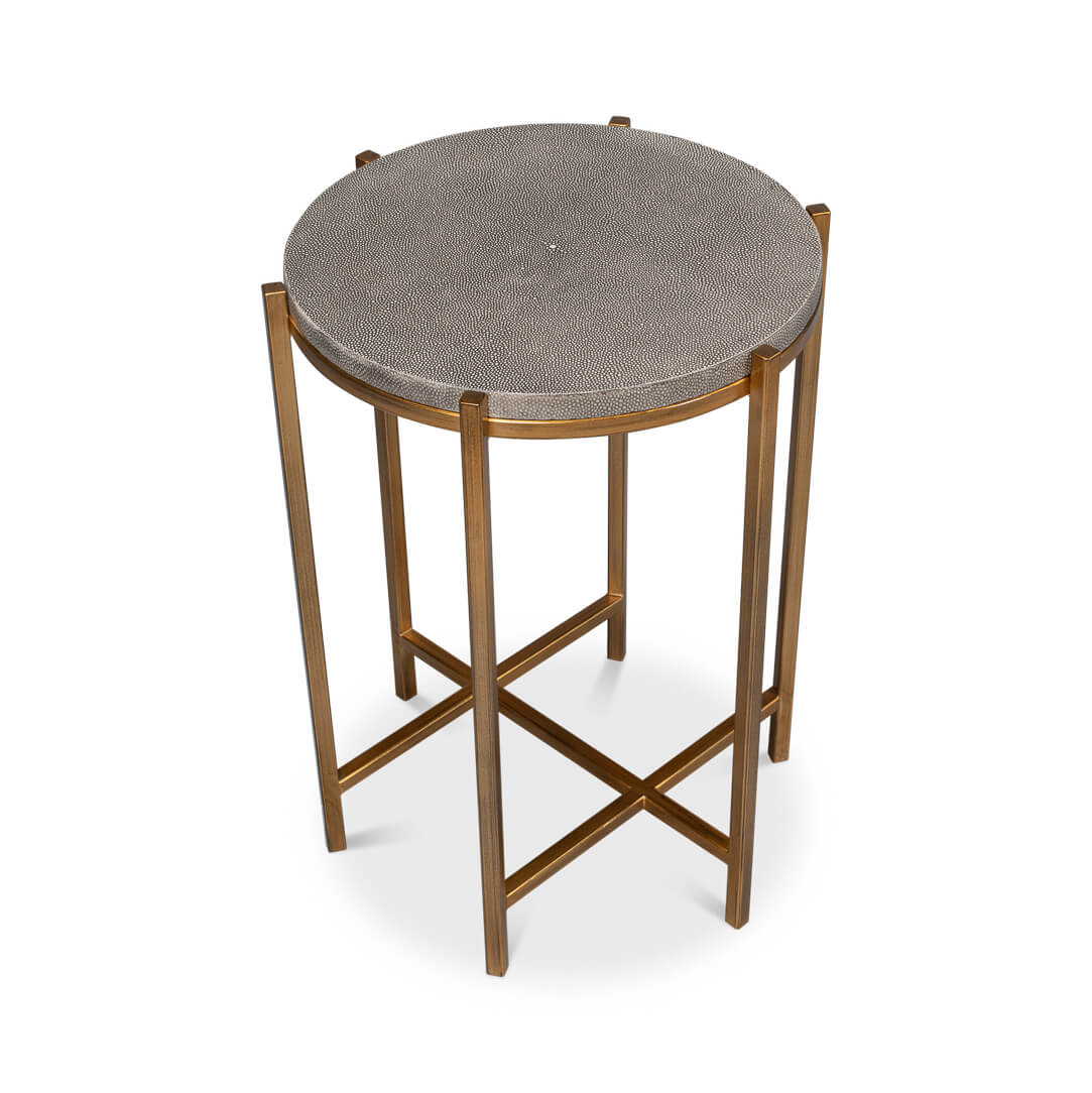High angle of round accent table, gray leather top.