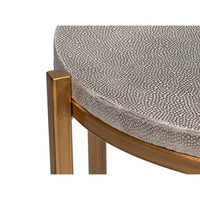 Edge detail of modern gray leather accent table.