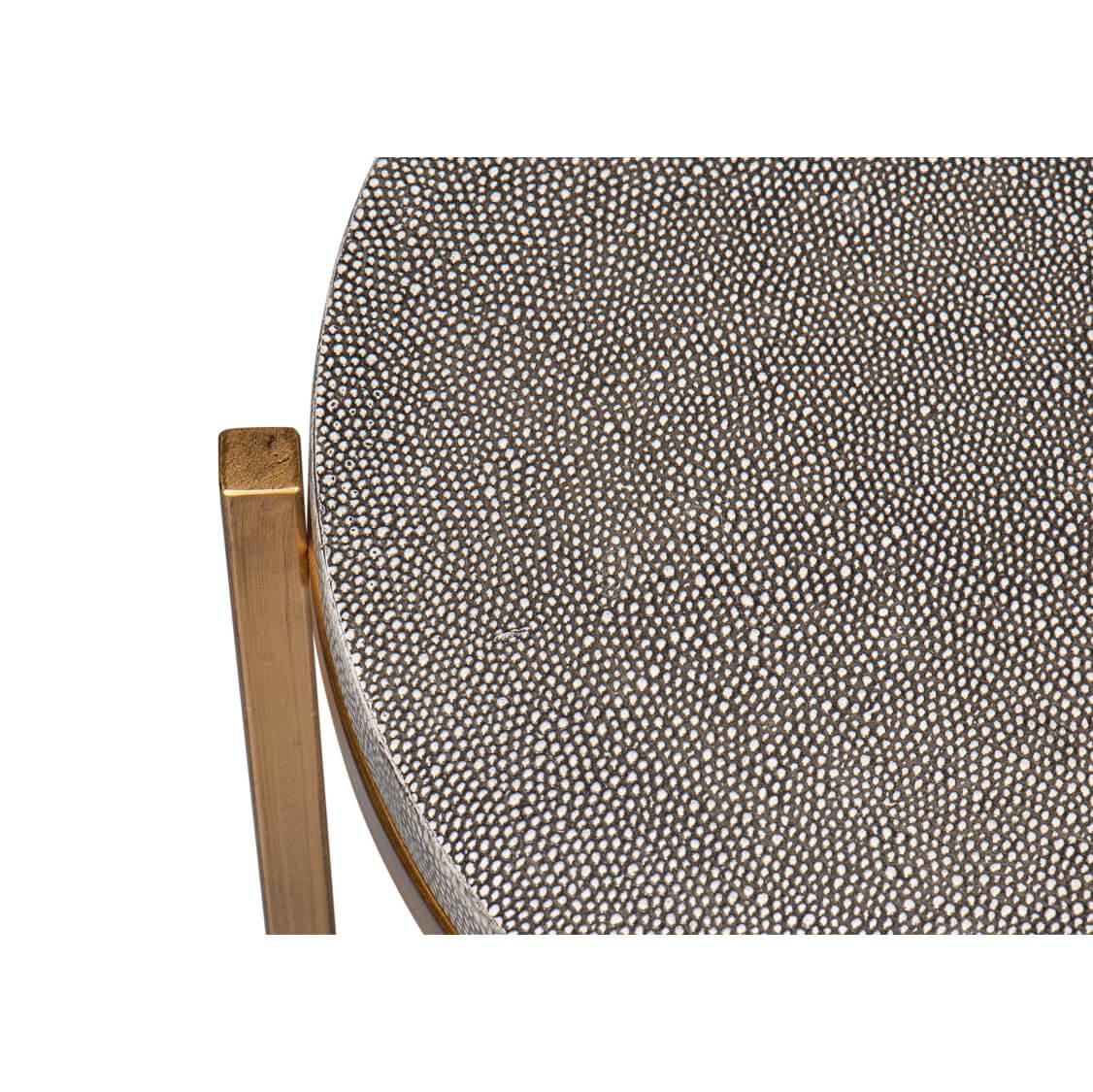 Close-up of gray leather surface on accent table.