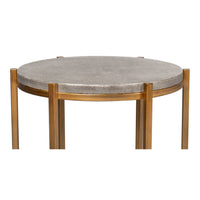 Side detail of round gray leather accent table.