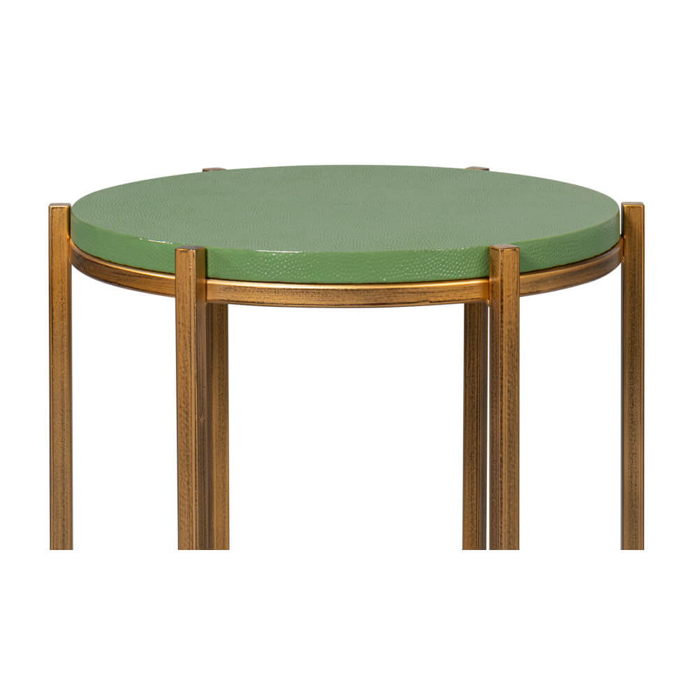Close-up, side view of green leather top table.